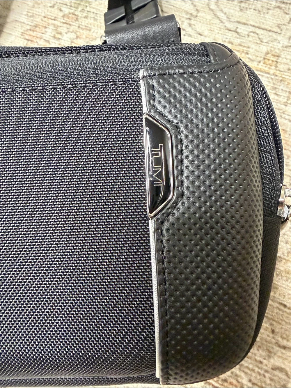 Tumi Black Men's Sling Belt Bag with Silver Accents